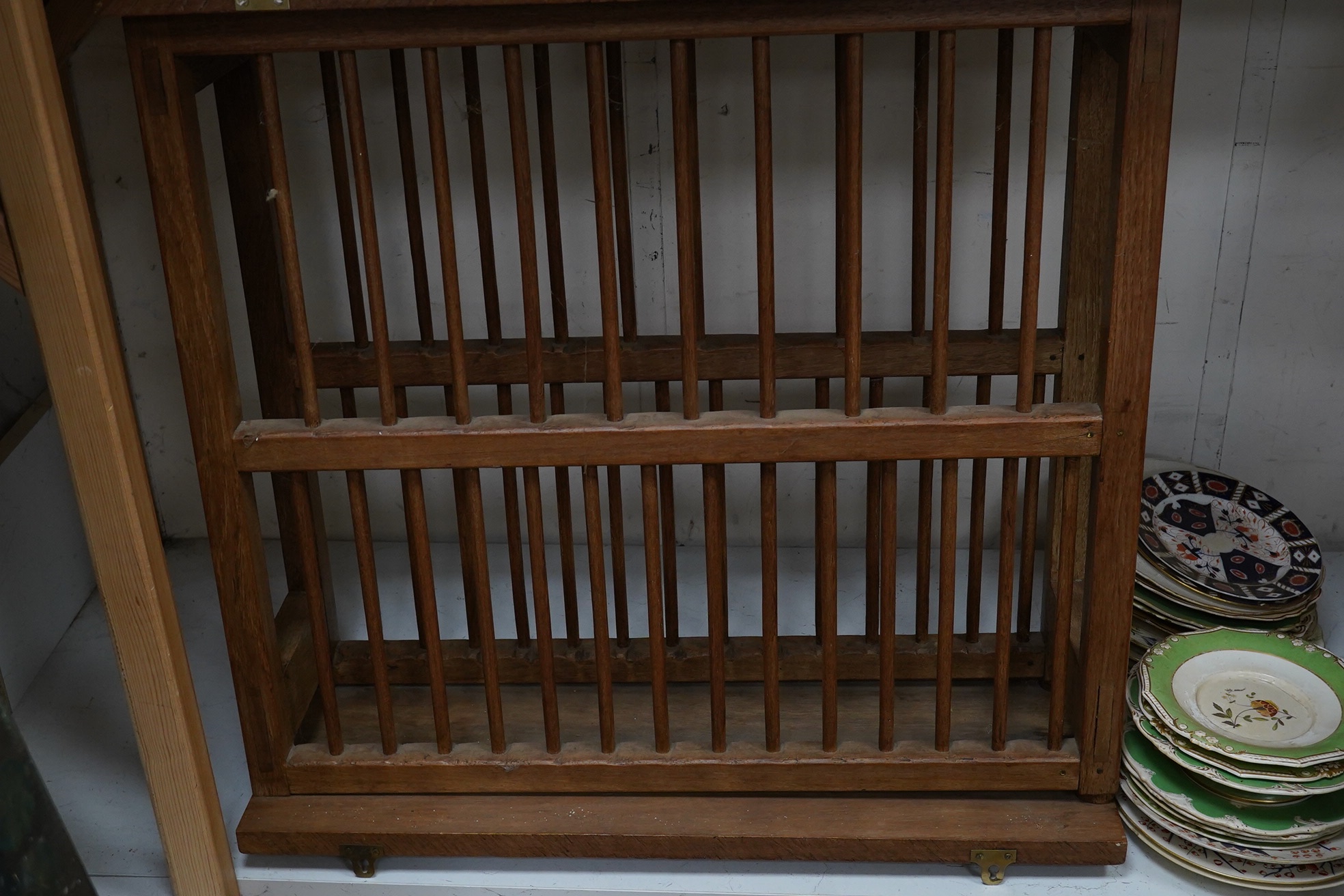 A teak plate rack with sundry antique plates. Condition - varies